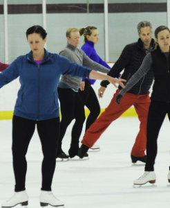 adult crowd skating at TC ice arens